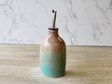 Wheel-thrown pottery oil cruet with food-safe glaze