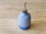 Handmade pottery oil dispenser – keeps oil fresh