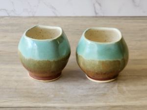 Wheel-thrown ceramic teacup with square opening