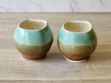Wheel-thrown ceramic teacup with square opening