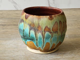 Artisan yunomi pottery cup in rustic glaze combination made in Melbourne.