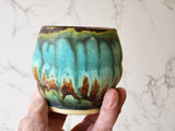 Handmade ceramic yunomi cup with earthy brown and green glaze made in Melbourne.
