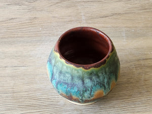 Handmade yunomi tea cup in rustic turquoise blue and brown glaze