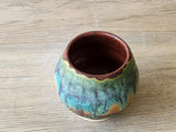Handmade yunomi tea cup in rustic turquoise blue and brown glaze