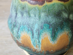 Close up of mottled glazes on the handmade pottery teacup