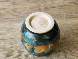 Bottom of the Rustic pottery yunomi with layered turquoise mossy glaze