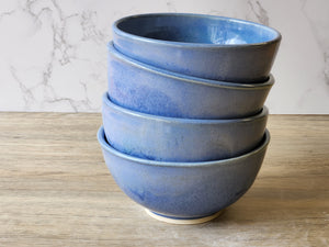 Handmade ceramic cereal bowl with blue mottled glaze