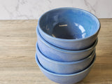 Artisan ceramic dessert bowl with rustic blue glaze