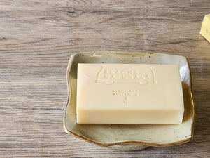 Cream ceramic soap dish with mother-of-pearl glaze