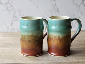 Rustic ceramic beer mugs with earthy red brown tones