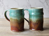 Rustic pottery mugs with natural earth-toned glaze