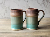 Rustic stoneware beer mugs with earthy green tones