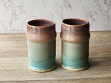 Handmade ceramic steins with earthy natural hues