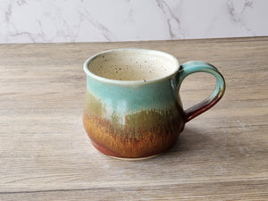 Artisan stoneware mug with amber and rust finish