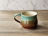 Handmade ceramic coffee cup with sturdy handle