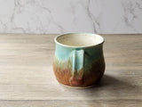Wheel-thrown stoneware mug with unique glaze pattern