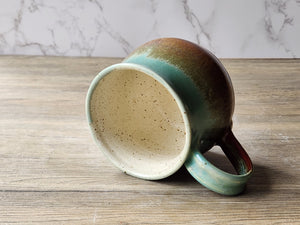Rustic handmade pottery mug in Australian landscape tones