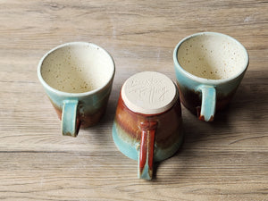 Spearmint and brown pottery espresso cup
