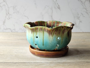 Rustic ceramic berry strainer bowl in green glaze