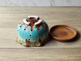 Australian pottery berry bowl with drainage holes and saucer
