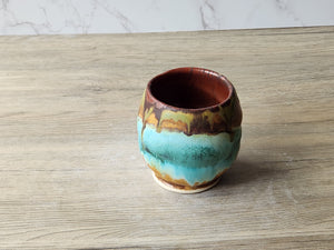 Handmade rustic yunomi teacup with green and brown glaze