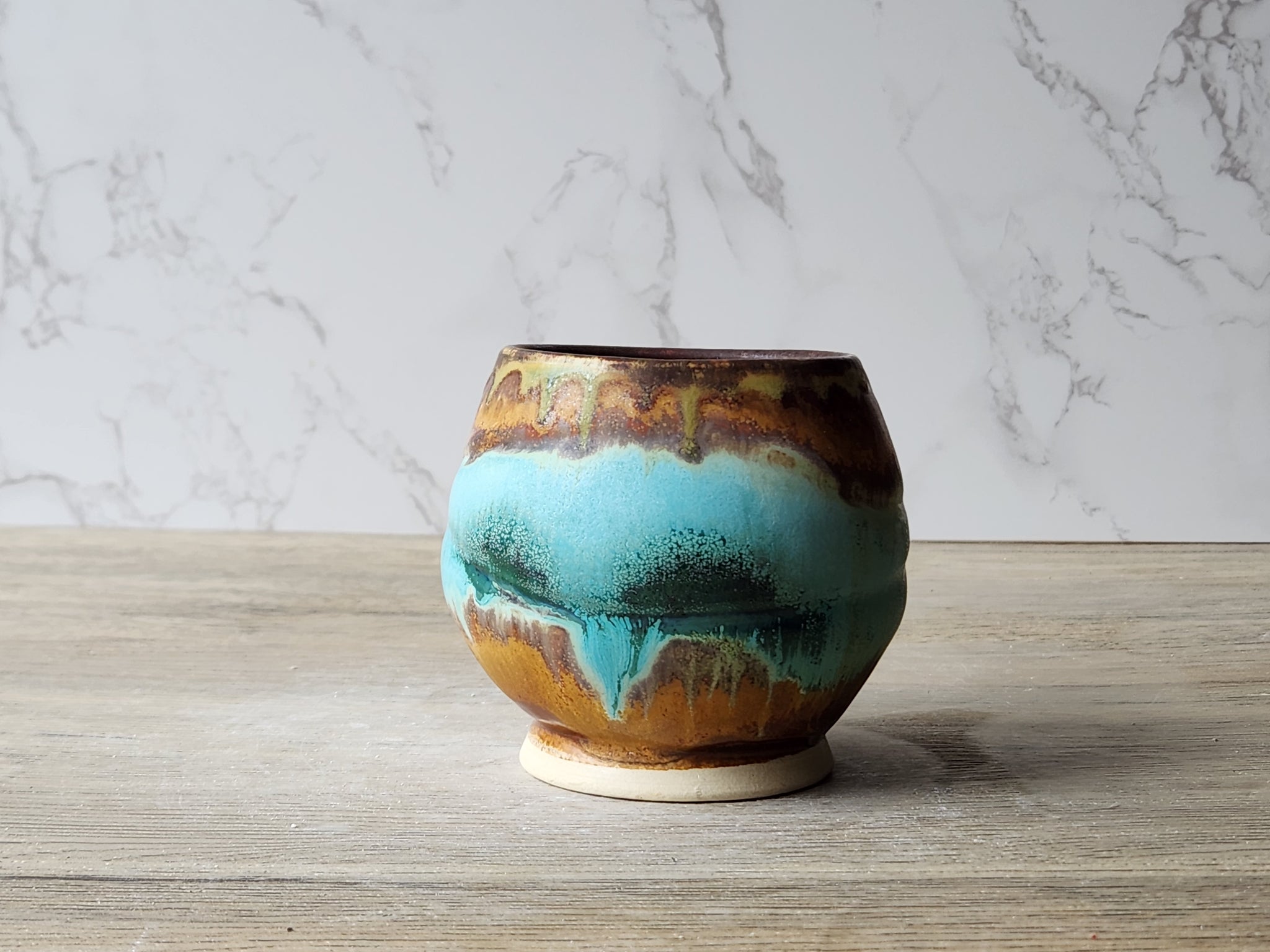 Japanese rustic yunomi cup with aqua brown glaze