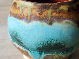 Close up of Pottery tea cup with horizon band glaze pattern