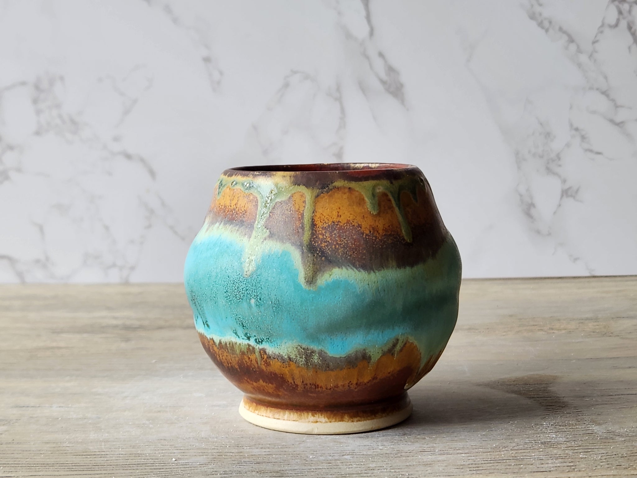 Rustic Japanese pottery yunomi in turquoise and amber