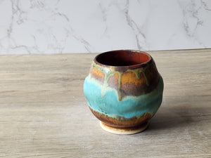 Artisan ceramic tea cup with mountain-inspired glaze