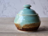 Artisan ceramic sugar pot with speckled cream interior