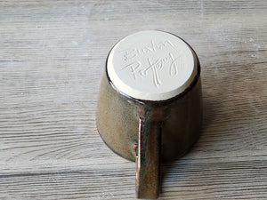 Handmade pottery espresso mug with brown highlights