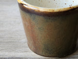 Rustic ceramic coffee cup handmade gift for coffee lovers - close up of glaze