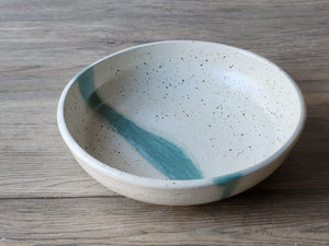 Ceramic dinnerware bowl with speckled cream glaze