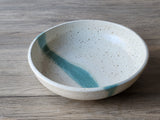 Ceramic dinnerware bowl with speckled cream glaze