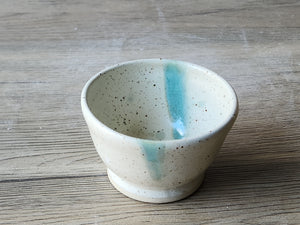 Rustic handmade pottery bowl with speckled glaze finish