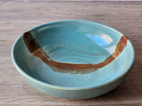 Handmade pottery dessert bowl with green and brown glaze