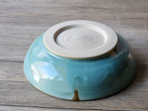 Underside of Unique handmade ceramic dinnerware spearmint green glaze