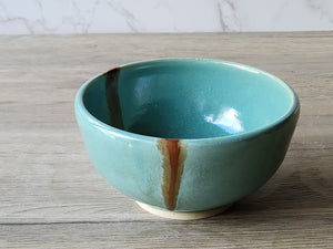 Handmade pottery dessert bowl with green and brown glaze