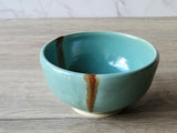 Handmade pottery dessert bowl with green and brown glaze