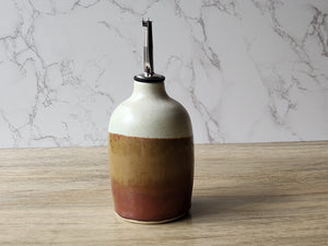 Artisan pottery olive oil dispenser with stainless steel pourer