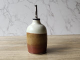 Artisan pottery olive oil dispenser with stainless steel pourer