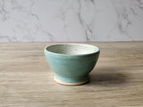 Small handmade stoneware bowl for kitchen or bedside use