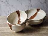 Rustic ceramic soup bowl with brown slash accent