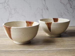 Artisan pottery noodle bowl in rustic cream and brown glaze