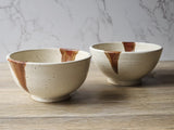 Artisan pottery noodle bowl in rustic cream and brown glaze
