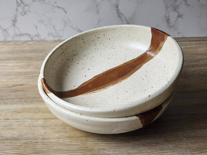 Speckled cream stoneware bowl with unique glaze variations