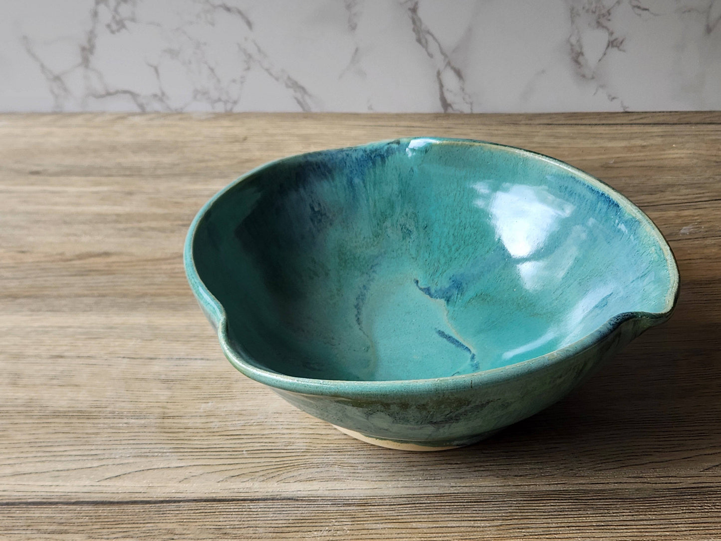 Large stoneware salad bowl with rustic green glaze