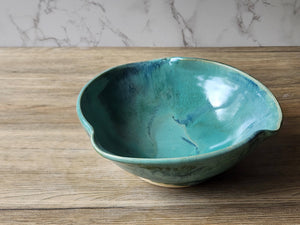 Large stoneware salad bowl with rustic green glaze