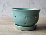 Artisan stoneware colander for rinsing and serving fresh berries