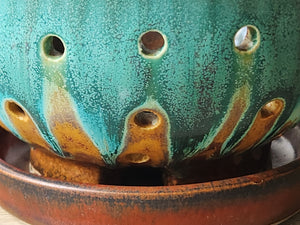 Close up of glaze on the Ceramic berry colander with matching drip saucer, artisan crafted